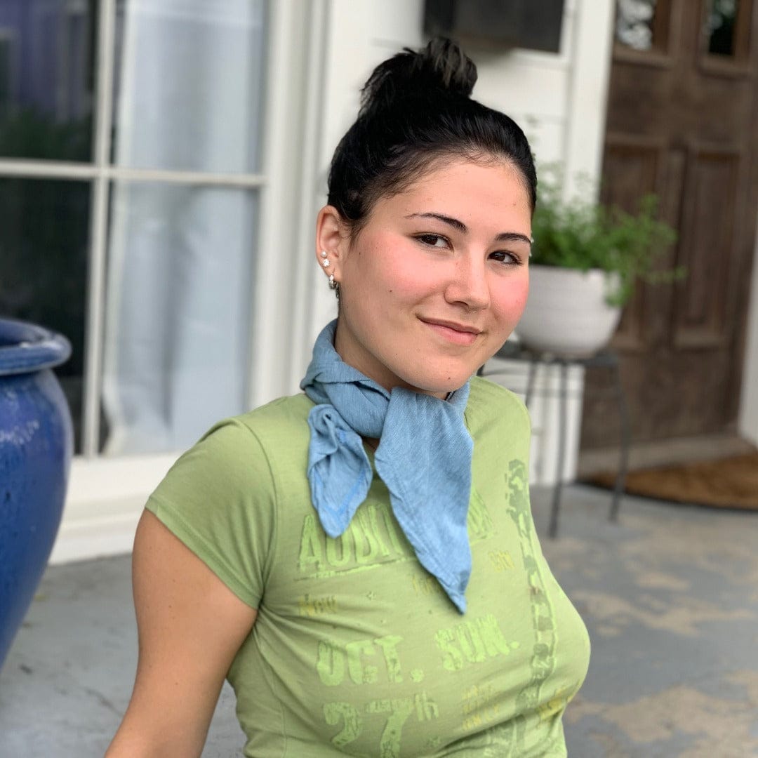 Woman with blue insect shield bandana 